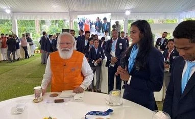 PM fulfils promise, has ice-cream with 2-time Olympic medallist PV Sindhu Modi with P V Sindhu