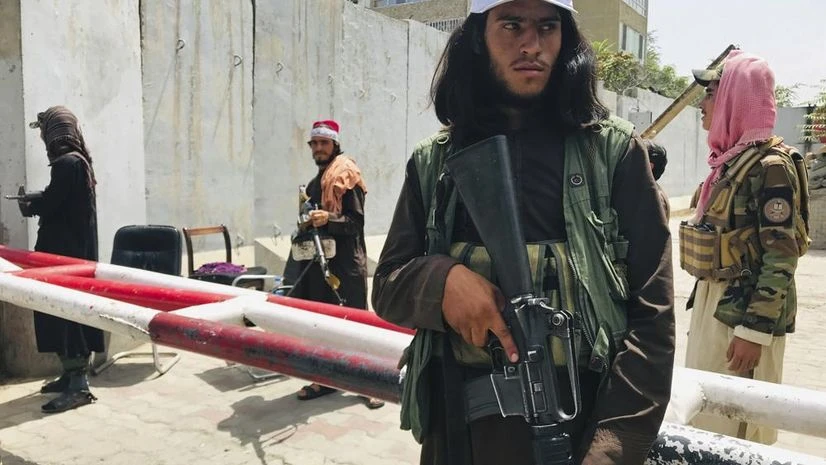 Taliban, Afghanistan Taliban fighters stand guard at a checkpoint that was previously manned by American troops near the US embassy, in Kabul, Afghanistan, Tuesday, Aug. 17, 2021. (AP Photo)
