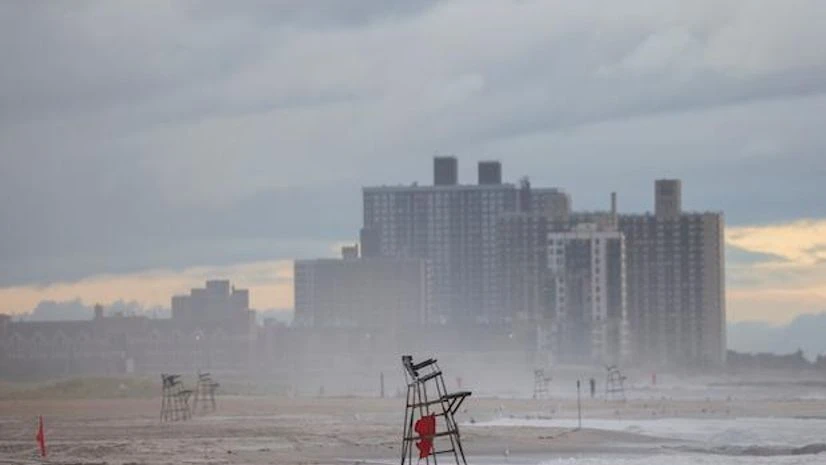 Henri Empty lifeguard chairs with warning flags are seen at a closed Rockaway beach after Tropical Storm Henri in New York (Photo: Reuters)