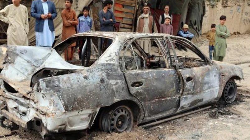 afghanistan Locals view a vehicle damaged by a rocket attack in Kabul (Photo: Reuters)