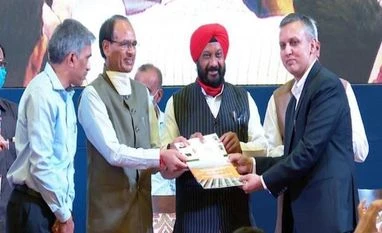 MP awards contracts for cheapest solar power; Rly to draw from seven states Mohit Bhargava, CEO, NTPC Renewable Energy, receiving a letter of award for 325 Mw of solar capacity at Shajapur solar park from Madhya Pradesh chief minister Shivraj Singh Chauhan at Bhopal on Wednesday. Hardeep Singh Dang, state new and renewable e