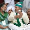 Bharatiya Kisan Union spokesperson Rakesh Tikait with Swaraj Abhiyan Chief Yogendra Yadav during a Kisan Mahapanchayat over the ongoing farmers agitation against Centres farm reform laws, in Muzaffarnagar (Photo: PTI)