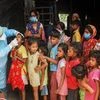 A health worker testing for Covid-19 collects swab samples from children who live in a slum Kolkata Monday, Sept. 6, 2021. (PTI photo.)
