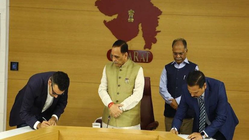 Vijay Rupani, Gujarat CM with Amazon India global trade director, Abhijit Kamra, Amazon signs pact with Gujarat to boost state MSMEs' e-commerce exports