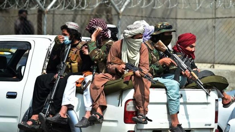 taliban Taliban fighters guard outside the airport in Kabul on Aug. 31.