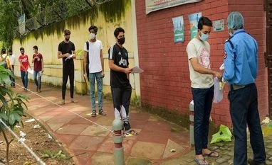 Mobile net services to be suspended in Assam today for recruitment exam Candidates undergo thermal screening to check their temperatures before they write the National Eligibility cum Entrance Test (NEET), which selects students for India's state-run medical colleges, at an examination centre in Delhi on September 12, 20