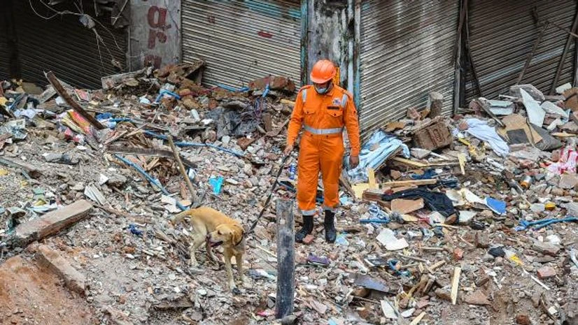 sabzi mandi building collapse An NDRF personnel during a rescue operation after a building collapsed at Sabji Mandi area in New Delhi (Photo: PTI)