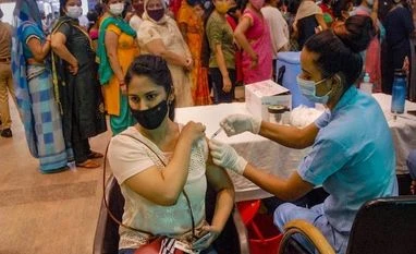 Delhi logs 39 Covid-19 cases, zero deaths; positivity rate at 0.06% A health worker administers a dose of Covid-19 vaccine to a visitor at a district government hospital in Noida on September 13, 2021. (PTI Photo)