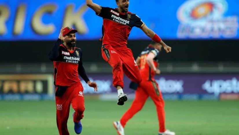 harshal patel Harshal Patel of Royal Challengers Bangalore celebrates his hat-trick wicket during match 39 of the Indian Premier League between the Royal Challengers Bengaluru and Mumbai Indians. Photo: PTI