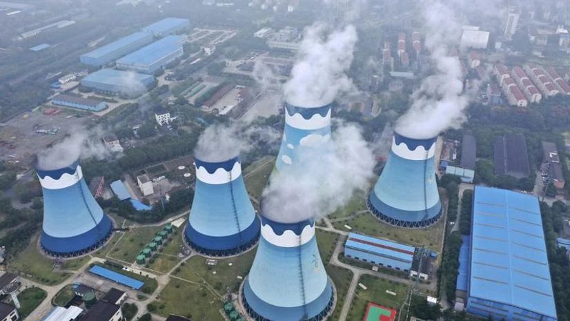 China coal plants Steam billows out of the cooling towers at a coal-fired power station in Nanjing in east China's Jiangsu province on Monday, Sept. 27, 2021.