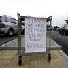 A sign referring to the lack of fuel is placed at the entrance to a petrol station in London, Tuesday, Sept. 28, 2021. Long lines of vehicles have formed at many gas stations around Britain since Friday, causing spillover traffic jams on busy roads.