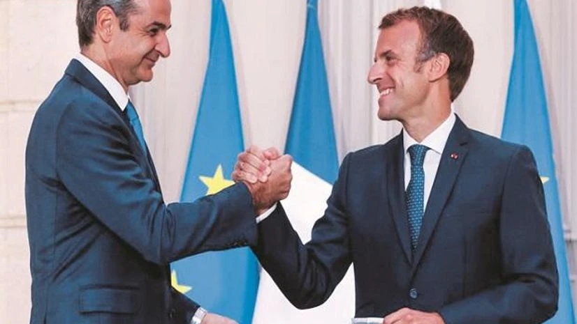 Greek Prime Minister Kyriakos Mitsotakis (left) and French President Emmanuel Macron shake hands after the signing of a new defence deal at The Elysee Palace on Tuesday. Greek Prime Minister Kyriakos Mitsotakis (left) and French President Emmanuel Macron shake hands after the signing of a new defence deal at The Elysee Palace on Tuesday. (Photo: AP)