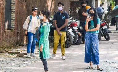 Educationists question system day after 8 DU colleges declare 100% cut-offs Students outside a college