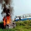 A vehicle set ablaze after violence broke out after farmers agitating were allegedly run over by a vehicle in the convoy of a union minister, in Lakhimpur Kheri. (PTI)