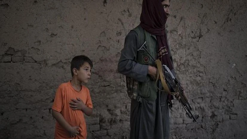 Taliban, Afghanistan Afghan men sit in the criminal cases room of a police station in Kabul, Afghanistan, Sunday, Sept. 19, 2021. The Taliban are shifting from being warriors to an urban police force. (AP Photo)