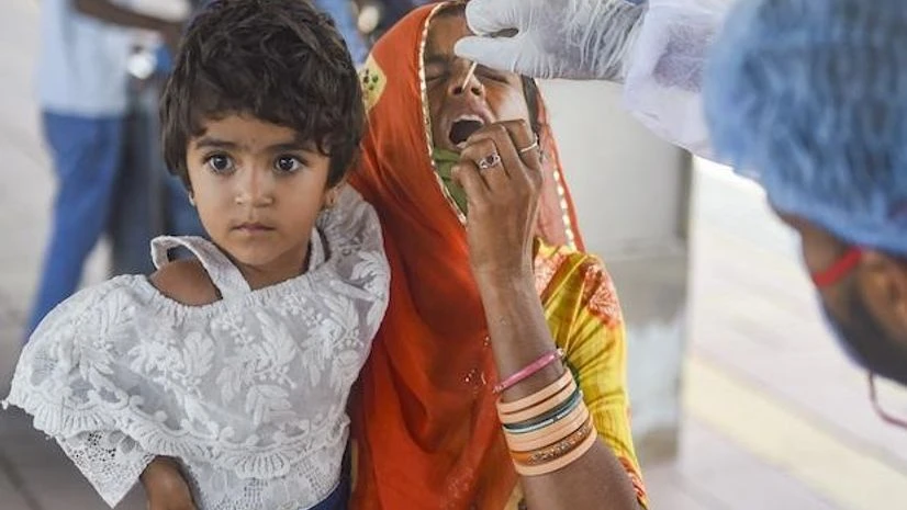 Representative image A health worker at Dadar railway station in Mumbai takes the swab sample of a woman to test for Covid-19 on October 5, 2021. (PTI Photo/Shashank Parade)