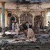 People view the damage inside of a mosque following a bombing in Kunduz, province northern Afghanistan (Photo: AP/PTI)