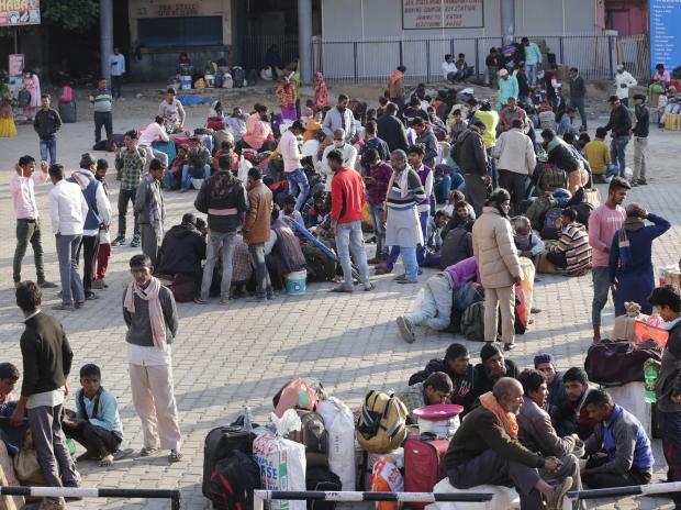 Migrant workers fleeing Kashmir throng railway stations, bus stands