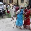 Elderly visitors arrive at a government hospital near Balurghat in South Dinajpur district of West Bengal on October 19, 2021. (PTI Photo)