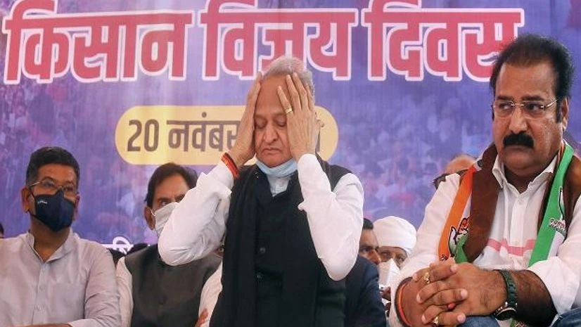 Rajasthan Chief Minister Ashok Ghelot (centre) and his party colleagues attend a programme in Jaipur on Saturday to celebrate the centre withdrawing three farm laws. (PTI Photo) Rajasthan Chief Minister Ashok Ghelot (centre) and his party colleagues attend a programme in Jaipur on Saturday to celebrate the centre withdrawing three farm laws. (PTI Photo)