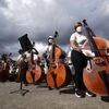 Members of the National Orchestra System gather to try and break a Guinness World Record for most instruments used in a piece of music, in Caracas, Venezuela, Saturday, Nov. 13, 2021. The musicians, all connected with the country’s network of youth o