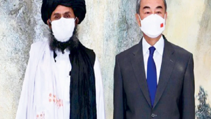 Mullah Abdul Ghani Baradar with Chinese State Councillor and Foreign Minister Wang Yi Mullah Abdul Ghani Baradar with Chinese State Councillor and Foreign Minister Wang Yi