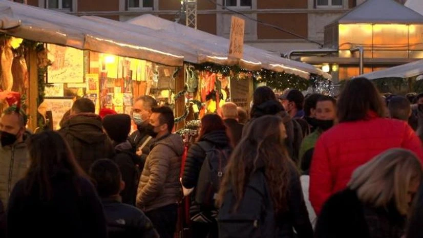 europe christmas Visitors shop at stalls of Trentos Christmas market during its opening weekend, despite fears of growing Covid infection cases in Trento, Italy (Photo: Reuters)