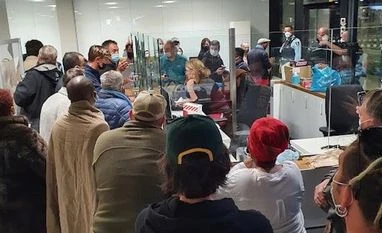 Dutch find 61 Covid cases among S.Africa passengers, looking for new strain Passengers waiting on their coronavirus test results at Schiphol Airport, in Amsterdam (Photo via Reuters)