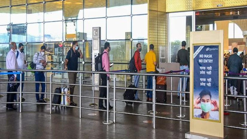 Covid, Mumbai airport Air passengers lined up at a terminal at the Chhatrapati Shivaji Maharaj International Airport, in Mumbai (Photo: PTI)