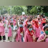 ASHA workers raise their arms during a protest in New Delhi, India, on Sunday, August 9, 2020. ASHA workers raise their arms during a protest in New Delhi, India, on Sunday, August 9, 2020.