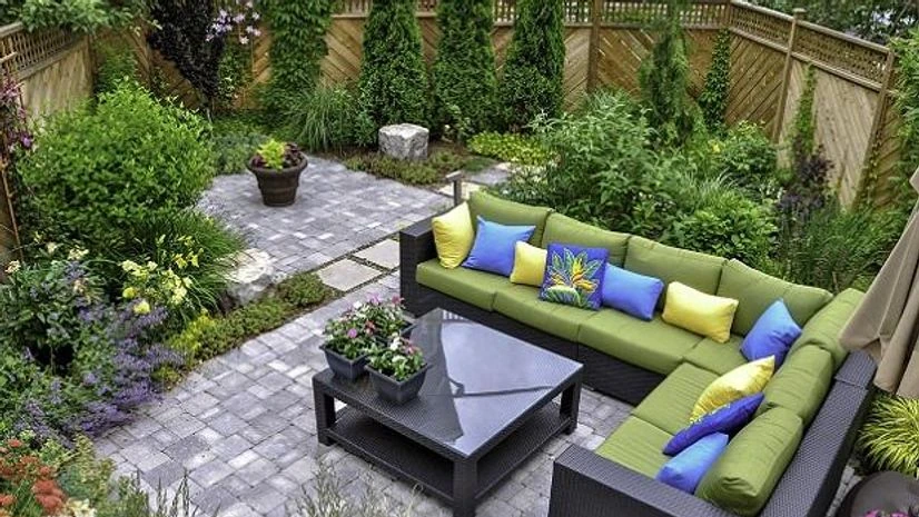 Urban garden A small, urban backyard garden featuring a tumbled paver patio, flagstone stepping stones, and a variety of trees, shrubs and perennials add colour and year-round interest. Photo credit: Adobe Stock