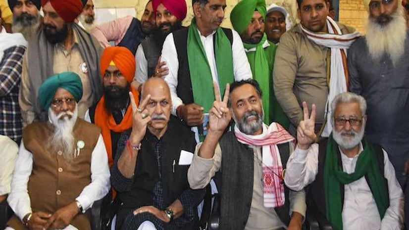 Activist Yogendra Yadav and Samyukta Kisan Morcha (SKM) leaders show victory sign after SKM announced to call off the farmers agitation, at Singhu border in New Delhi (Photo: PTI) Activist Yogendra Yadav and Samyukta Kisan Morcha (SKM) leaders show victory sign after SKM announced to call off the farmers agitation, at Singhu border in New Delhi (Photo: PTI)