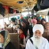Farmers sit inside a bus as they vacate a protest site, at the Singhu border near New Delhi (Photo: Reuters)