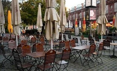 Covid-19: Euro zone business growth slipped in December as Omicron rose Empty chairs and tables are pictured in Berlin (Photo: Reuters)