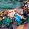 Mangled remains of an autorickshaw which was crushed under a container vehicle in an accident, near IGI Stadium, in New Delhi (Photo: PTI)