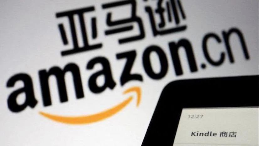 Amazon, China, The sign of e-commerce website Amazon China is seen next to a Kindle e-reader displayed in this illustration (Reuters)