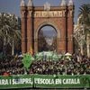 Demonstrators march holding banners and shouting slogans demanding the use of Catalan in schools of Catalonia, in Barcelona (Photo: AP/PTI)