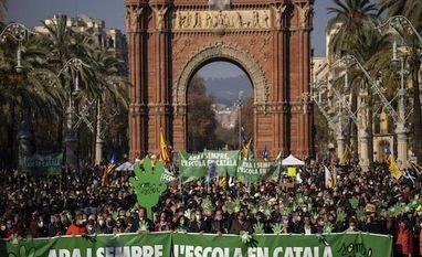 Catalans protest against mandate for more Spanish in schools Demonstrators march holding banners and shouting slogans demanding the use of Catalan in schools of Catalonia, in Barcelona (Photo: AP/PTI)