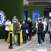 Staff arrive to give the booster dose outside a coronavirus disease pop-up vaccination centre at Chelsea football ground, Stamford Bridge in London (Photo: Reuters)