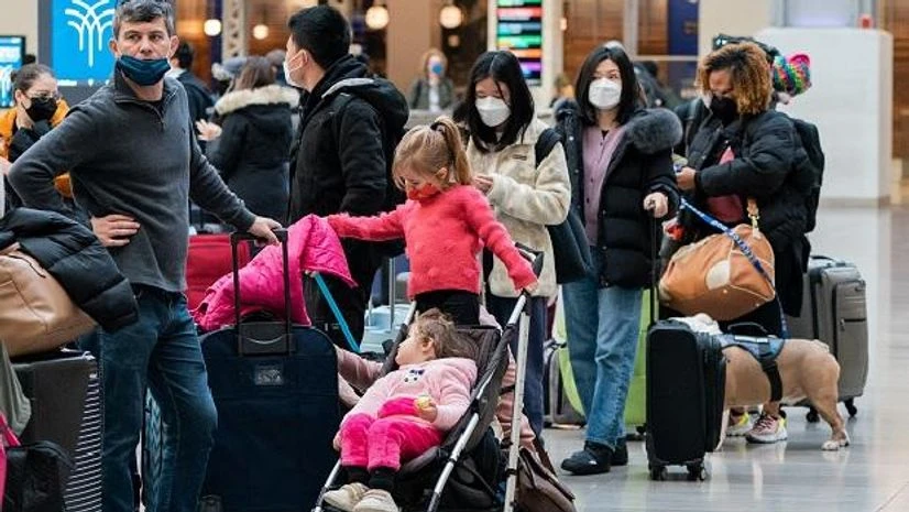 Travellers wait for trains at the Moynihan Train Hall at Penn Station ahead of the Christmas holiday, in New York City (Photo: Reuters) Travellers wait for trains at the Moynihan Train Hall at Penn Station ahead of the Christmas holiday, in New York City (Photo: Reuters)