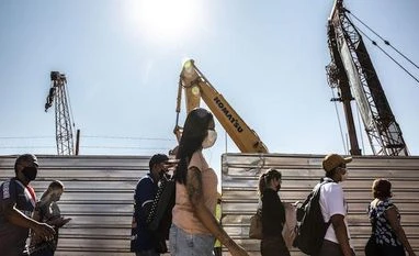 Traders see emerging markets rising in 2022, but not until July markets