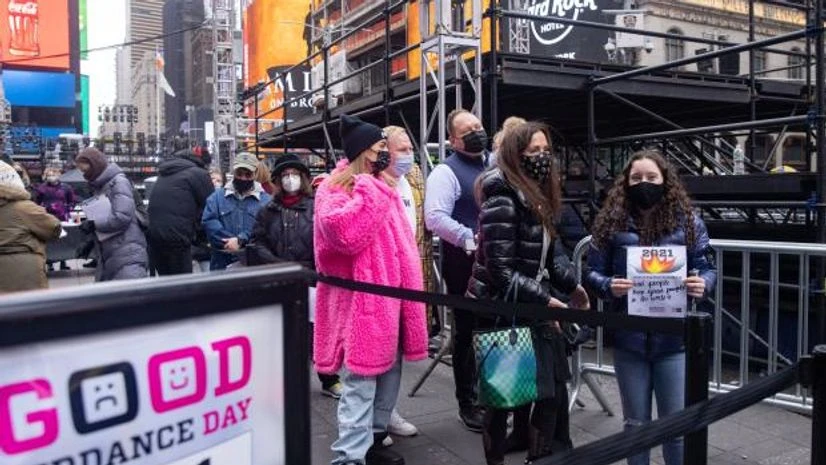 NYC People line up to burn papers containing things from year 2021 that they are looking forward to saying goodbye to, at an event in Times Square called Good Riddance Day, amid the Covid pandemic, in New York City (Photo: Reuters)
