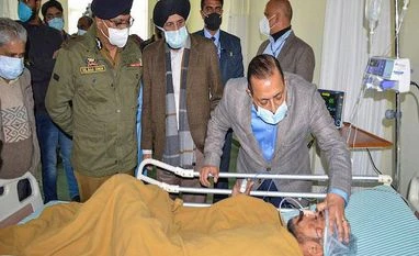 Three-member panel on Vaishno Devi stampede to submit report within a week Union Minister Jitendra Singh, accompanied by J&K DGP Dilbag Singh, meets with injured victims of the Mata Vaishno Devi shrine stampede, at a hospital near Jammu (Photo: PTI)