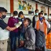 A health worker collects swab sample of a passenger for Covid-19 test, amid fear of spread of the Omicron variant of Covid, at Krantiveer Sangoli Rayanna (KSR) railway station in Bengaluru (Photo: PTI)