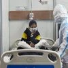 A Covid-19 infected patient rests on her bed inside a Covid care centre of the Commonwealth Games (CWG) village, in New Delhi (Photo: PTI)