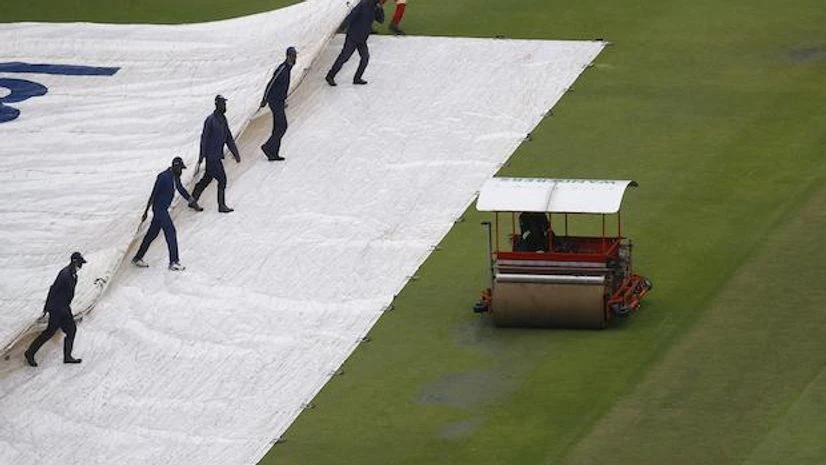 General view of groundstaff moving the rain cover as rain delays the start of the day's play (Photo: Reuters) General view of groundstaff moving the rain cover as rain delays the start of the day's play (Photo: Reuters)