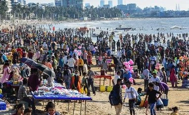 coronavirus People gather at the Juhu beach amid restrictions imposed due to rising Covid-19 cases in Mumbai. (Photo: PTI)
