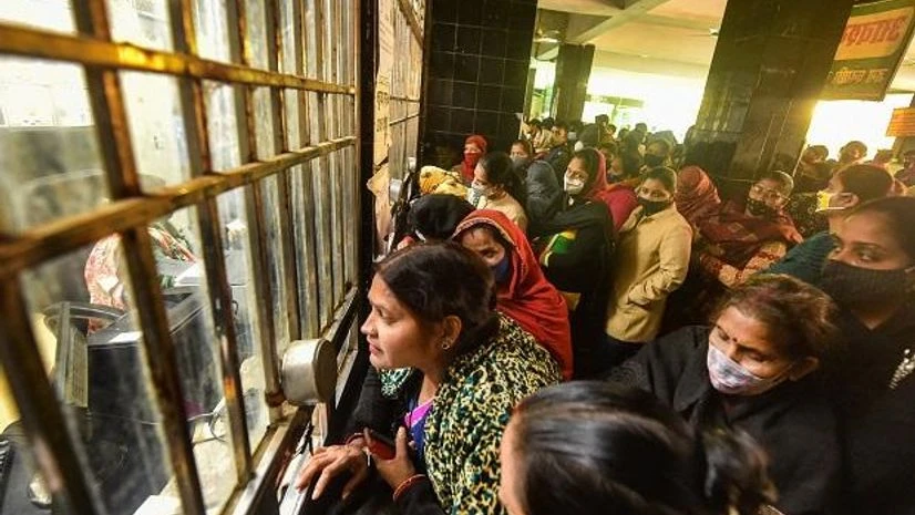 covid coronavirus hospital Patients flout social distancing norms as buy medicines at a hospital in Lucknow on January 10, 2022. (PTI Photo/Nand Kumar)