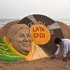 Sand artist Sudarsan Pattnaik creates a sand sculpture wishing legendary singer Lata Mangeshkar a speedy recovery from COVID-19, at Puri beach (Photo: PTI)
