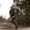 A member of Ukraine's Territorial Defense Forces participates in a drill during training at a former asphalt factory on the outskirts of Kyiv, Ukraine, on Saturday, Feb. 19, 2022. (Photo: Ethan Swope/Bloomberg)